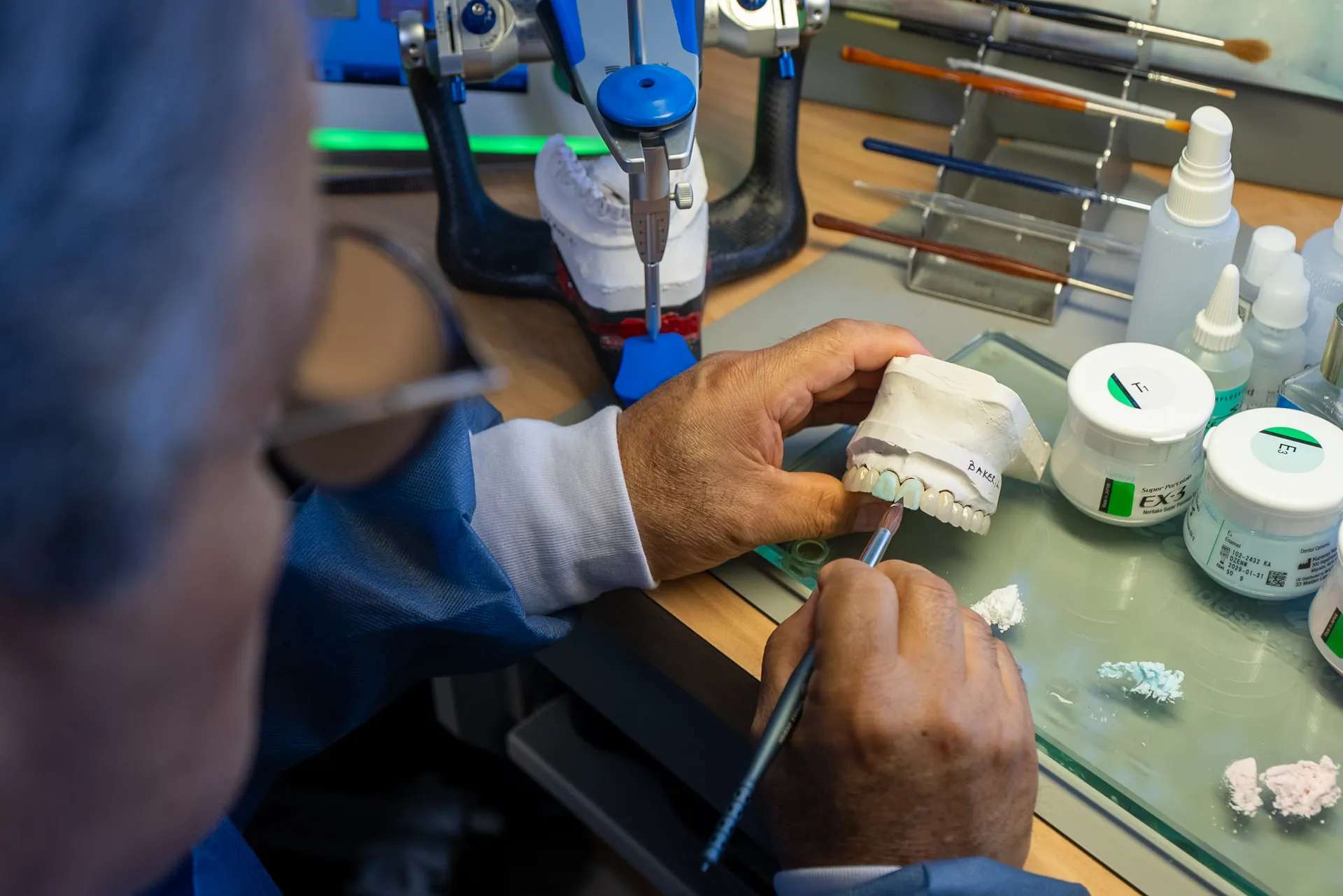 A dental restoration being crafted by hand in the Elite Prosthetic Dentistry in-house laboratory